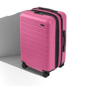 AWAY Bigger Carry-On Flex suitcase in ISLAND PINK
